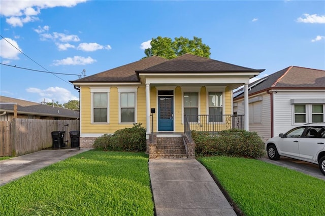 2060 Saint Denis St, New Orleans, LA 70122 - view of front of house with a porch and roof with shingles
