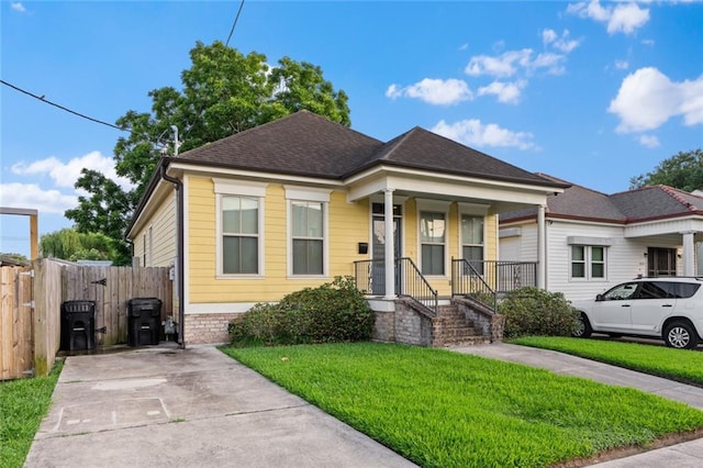 2060 Saint Denis St, New Orleans, LA 70122 - view of front of house with covered porch and a shingled roof