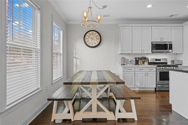 2060 Saint Denis St, New Orleans, LA 70122 - dining space with a chandelier, crown molding, dark wood-type flooring, and recessed lighting