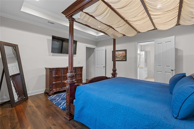 2060 Saint Denis St, New Orleans, LA 70122 - bedroom featuring wood finished floors, a raised ceiling, crown molding, and ensuite bathroom