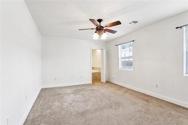 3211 Jackson Blvd, Chalmette, LA 70043 - unfurnished bedroom featuring carpet, ceiling fan, and ensuite bathroom