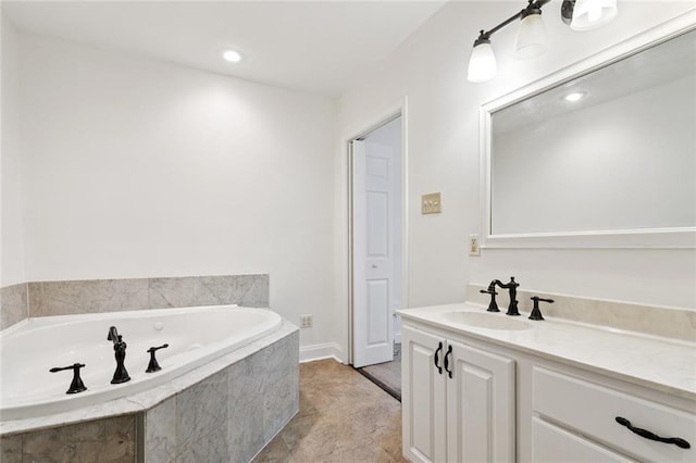 3211 Jackson Blvd, Chalmette, LA 70043 - bathroom featuring vanity, a garden tub, and recessed lighting