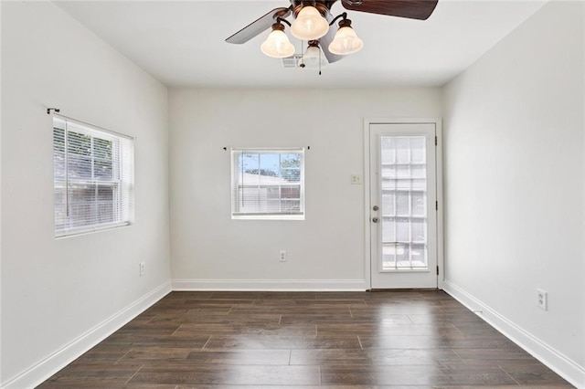 3211 Jackson Blvd, Chalmette, LA 70043 - spare room with a ceiling fan and dark wood-type flooring