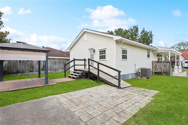 3211 Jackson Blvd, Chalmette, LA 70043 - rear view of property with a patio, a fenced backyard, a gazebo, and a gate