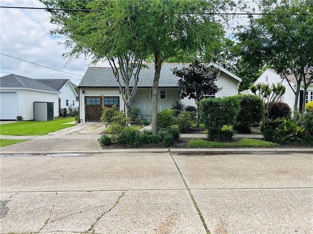402 Orion Ave, Metairie, LA 70005 - view of front of home with driveway, an attached garage, and roof with shingles