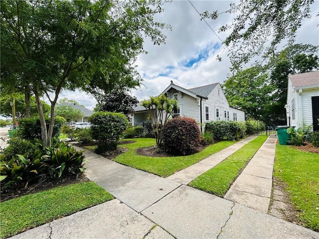 402 Orion Ave, Metairie, LA 70005 - view of side of property with concrete driveway and a yard
