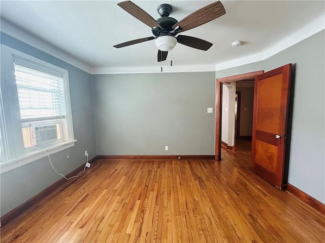 402 Orion Ave, Metairie, LA 70005 - unfurnished room featuring cooling unit, crown molding, light wood-type flooring, ceiling fan, and a smoke detector