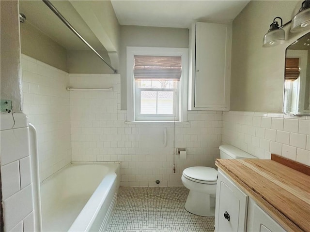 402 Orion Ave, Metairie, LA 70005 - full bathroom featuring tile walls, tile patterned floors, vanity, a wainscoted wall, and shower / bathtub combination