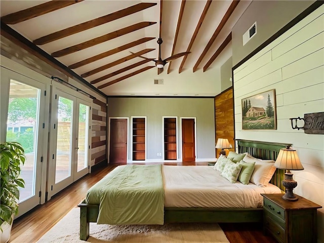 402 Orion Ave, Metairie, LA 70005 - bedroom with wood walls, access to exterior, beam ceiling, high vaulted ceiling, and wood finished floors