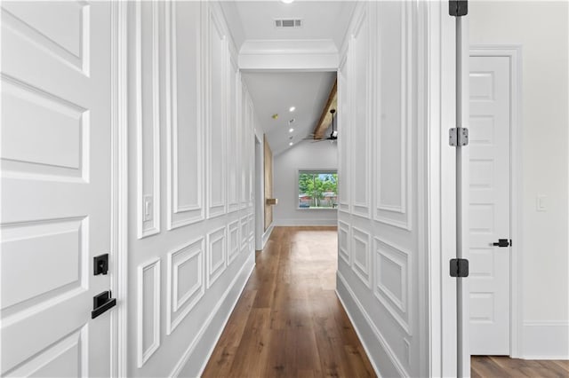 7717 Richard St, Metairie, LA 70003 - corridor featuring dark wood-style floors, vaulted ceiling, and recessed lighting