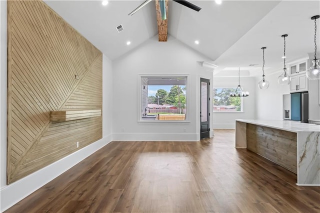 7717 Richard St, Metairie, LA 70003 - unfurnished living room featuring ceiling fan, dark wood-type flooring, a chandelier, and recessed lighting