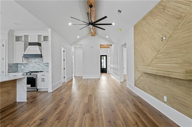 7717 Richard St, Metairie, LA 70003 - unfurnished living room featuring a ceiling fan, dark wood finished floors, lofted ceiling, and recessed lighting