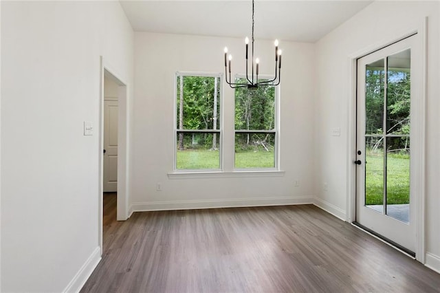 69206 4th Ave, Covington, LA 70433 - unfurnished dining area featuring a chandelier and dark wood finished floors