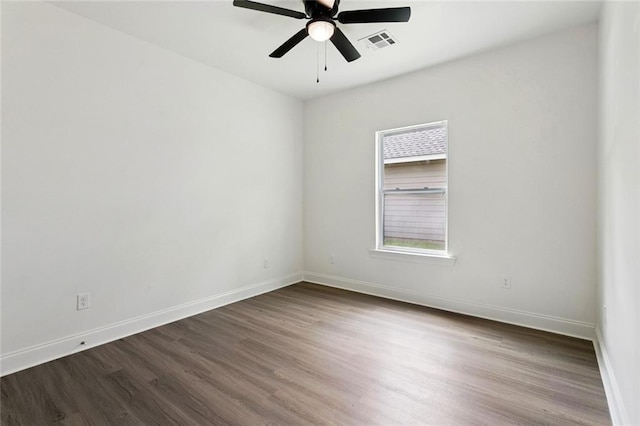69206 4th Ave, Covington, LA 70433 - unfurnished room featuring dark wood-style flooring and a ceiling fan