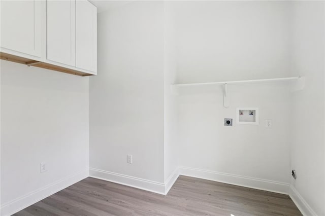 69206 4th Ave, Covington, LA 70433 - laundry room with hookup for a washing machine, electric dryer hookup, cabinet space, and wood finished floors