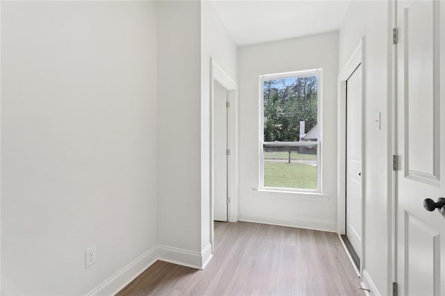 69206 4th Ave, Covington, LA 70433 - doorway to outside featuring baseboards and light wood-style floors