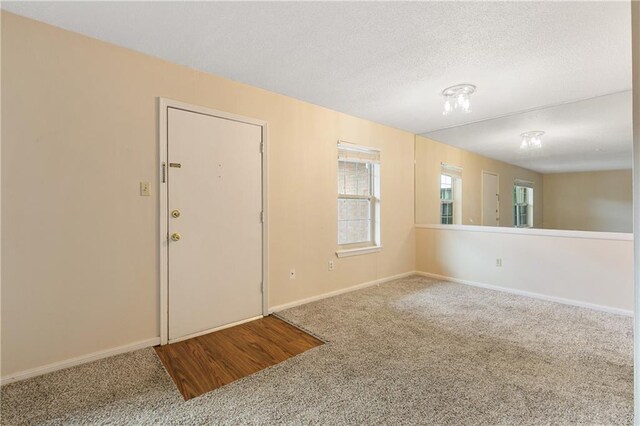 2700 Whitney Pl Unit 826, Metairie, LA 70002 - carpeted empty room featuring baseboards and a textured ceiling