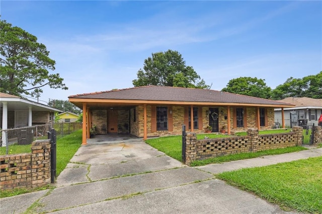 1319 Sumner St, New Orleans, LA 70114 - ranch-style house with concrete driveway, a carport, and covered porch