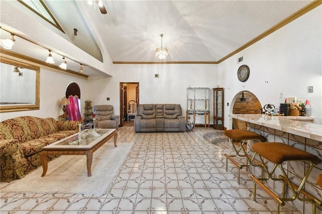 1319 Sumner St, New Orleans, LA 70114 - living room with high vaulted ceiling, ornamental molding, and a chandelier
