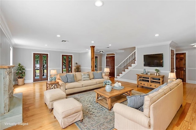 2801 Lakeshore Dr, Mandeville, LA 70448 - living room with decorative columns, recessed lighting, stairway, ornamental molding, and light wood-type flooring