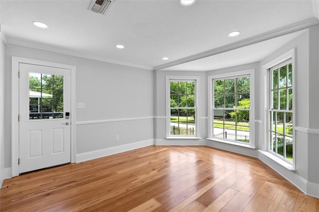 2801 Lakeshore Dr, Mandeville, LA 70448 - spare room with healthy amount of natural light, recessed lighting, crown molding, and light wood-type flooring