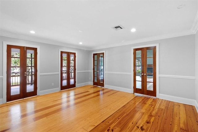 2801 Lakeshore Dr, Mandeville, LA 70448 - foyer entrance with french doors, crown molding, wood finished floors, and recessed lighting
