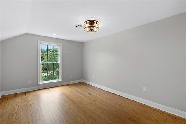 2801 Lakeshore Dr, Mandeville, LA 70448 - unfurnished room with wood finished floors and lofted ceiling