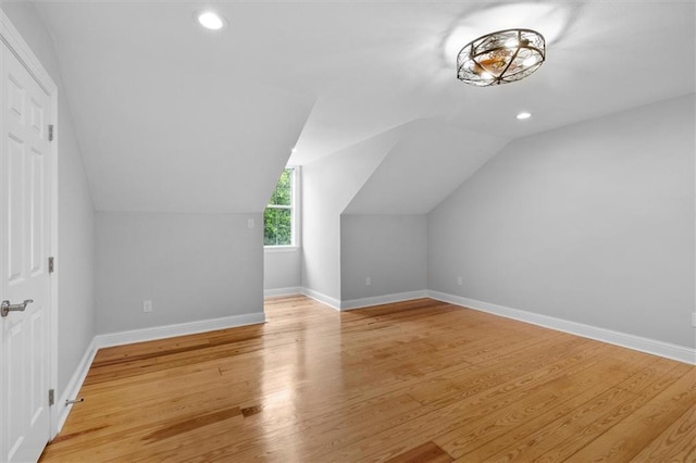 2801 Lakeshore Dr, Mandeville, LA 70448 - additional living space with recessed lighting, light wood-style flooring, and vaulted ceiling