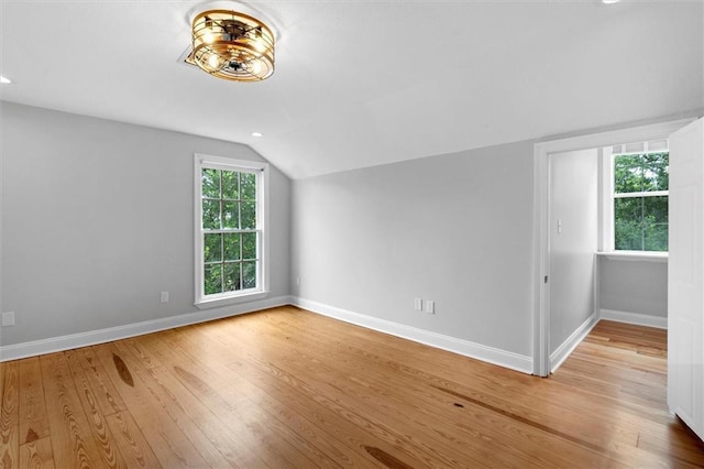 2801 Lakeshore Dr, Mandeville, LA 70448 - bonus room featuring lofted ceiling and wood finished floors