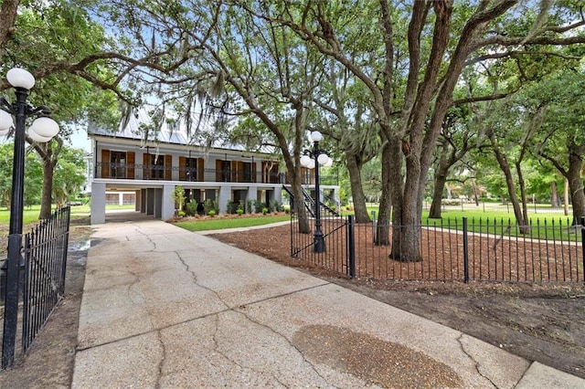 2801 Lakeshore Dr, Mandeville, LA 70448 - view of front of house with driveway and a carport
