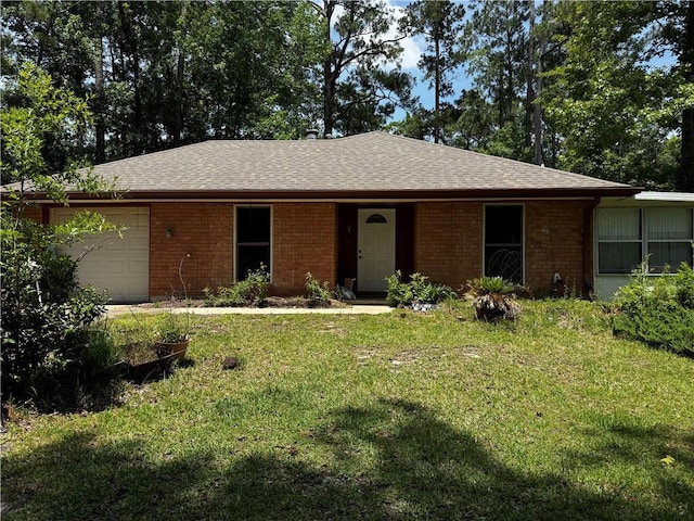 34121 Longleaf Ln, Slidell, LA 70460 - ranch-style house with brick siding, a front yard, a shingled roof, and an attached garage