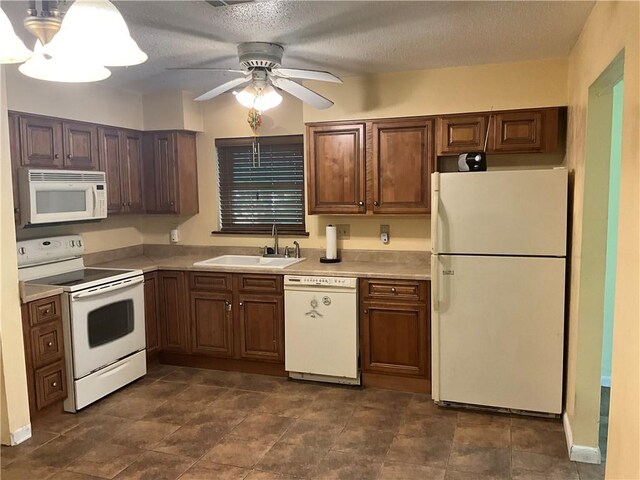 34121 Longleaf Ln, Slidell, LA 70460 - kitchen with white appliances, a textured ceiling, light countertops, and ceiling fan