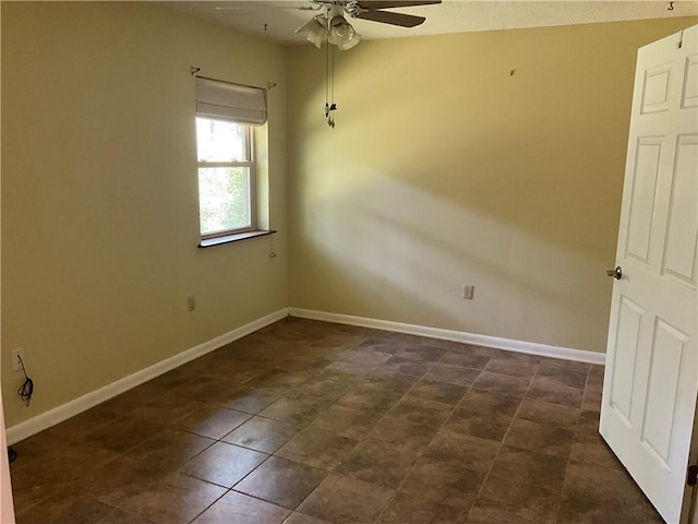 34121 Longleaf Ln, Slidell, LA 70460 - empty room with a ceiling fan and dark tile patterned flooring