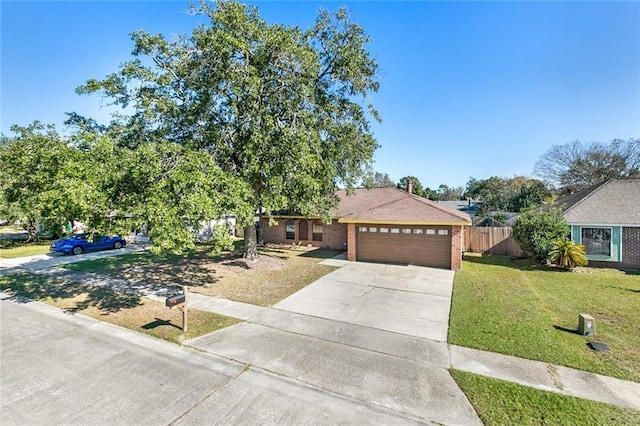 806 N Pearl Dr, Slidell, LA 70461 - ranch-style house with concrete driveway, a garage, and brick siding