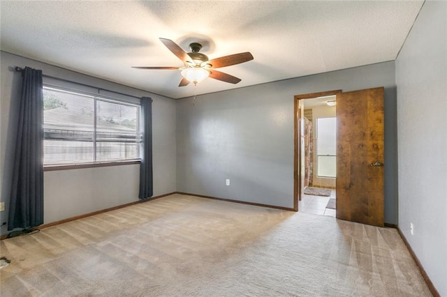 806 N Pearl Dr, Slidell, LA 70461 - unfurnished room featuring light carpet, ceiling fan, and a textured ceiling