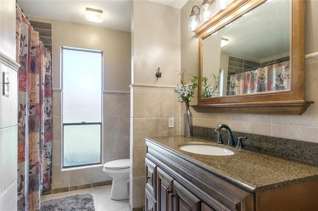 806 N Pearl Dr, Slidell, LA 70461 - bathroom featuring tile walls, vanity, and tile patterned floors