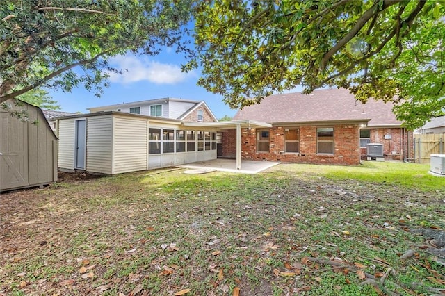145 Macque Dr, Harahan, LA 70123 - rear view of property with a shed, a patio, a sunroom, and brick siding