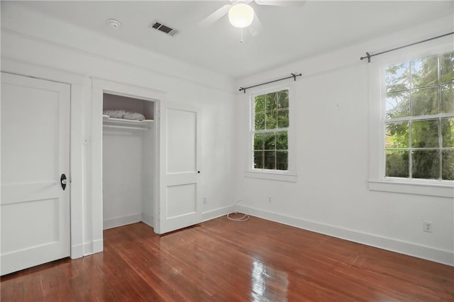 322426 Calhoun St, New Orleans, LA 70125 - unfurnished bedroom with dark wood-type flooring, a closet, and a ceiling fan