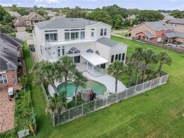 3128 Palm Vista Dr, Metairie, LA 70003 - rear view of property featuring stucco siding, a fenced backyard, a residential view, and a shingled roof