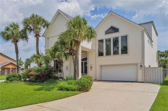 3128 Palm Vista Dr, Metairie, LA 70003 - view of front of home with stucco siding, a garage, and concrete driveway