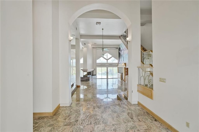 3128 Palm Vista Dr, Metairie, LA 70003 - hall featuring arched walkways and marble tiled flooring