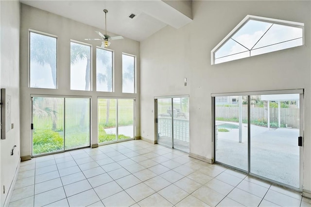 3128 Palm Vista Dr, Metairie, LA 70003 - spare room with high vaulted ceiling, ceiling fan, healthy amount of natural light, and light tile patterned floors