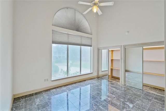 3128 Palm Vista Dr, Metairie, LA 70003 - unfurnished bedroom featuring multiple closets and ceiling fan