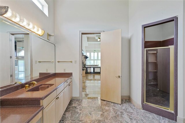 3128 Palm Vista Dr, Metairie, LA 70003 - full bathroom with vanity, a stall shower, and marble finish floors