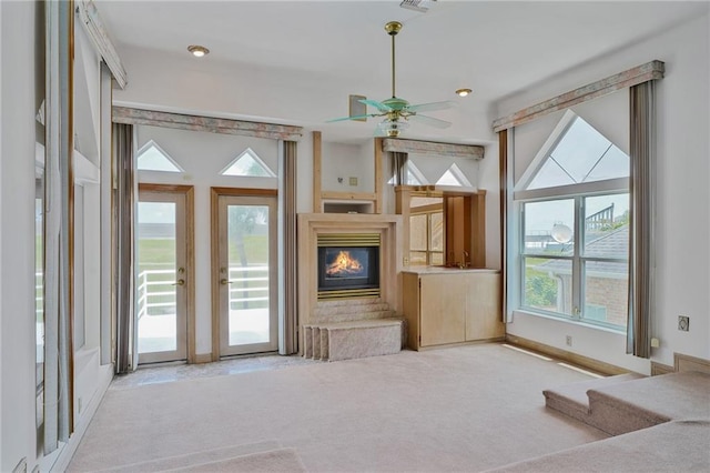 3128 Palm Vista Dr, Metairie, LA 70003 - unfurnished living room with carpet floors, a glass covered fireplace, and ceiling fan