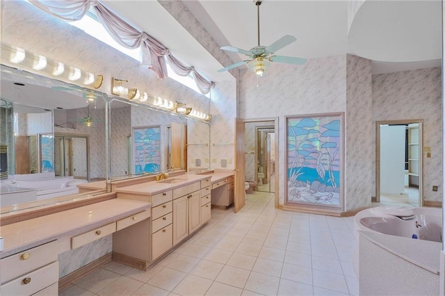 3128 Palm Vista Dr, Metairie, LA 70003 - bathroom with tile patterned flooring, wallpapered walls, vanity, and a ceiling fan