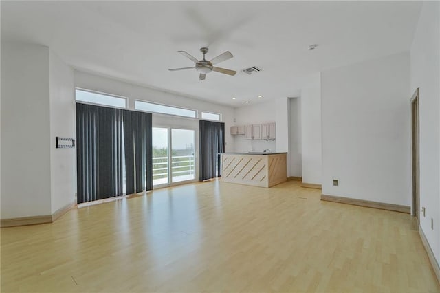 3128 Palm Vista Dr, Metairie, LA 70003 - unfurnished living room with ceiling fan, light wood finished floors, and recessed lighting