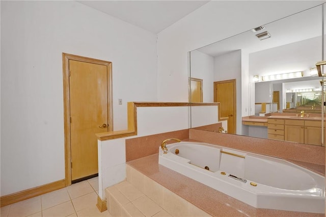 3128 Palm Vista Dr, Metairie, LA 70003 - bathroom with a jetted tub, tile patterned flooring, and vanity