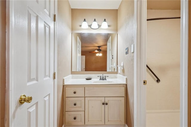 4808 Fairfield St, Metairie, LA 70006 - bathroom with a stall shower, vanity, ceiling fan, and a textured wall