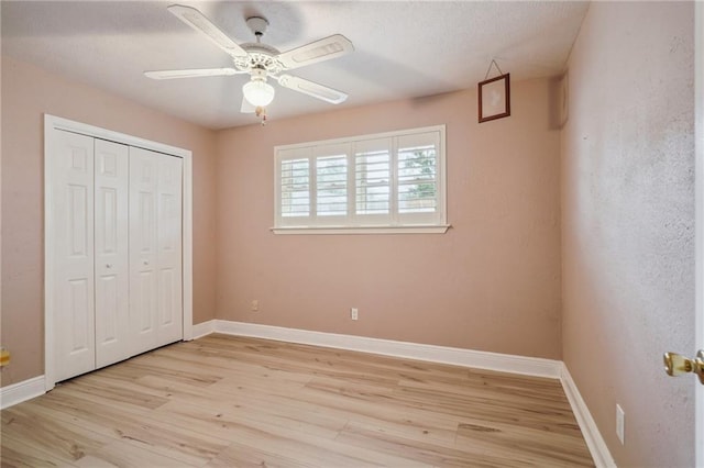 4808 Fairfield St, Metairie, LA 70006 - unfurnished bedroom featuring light wood-type flooring, a closet, a ceiling fan, and a textured ceiling